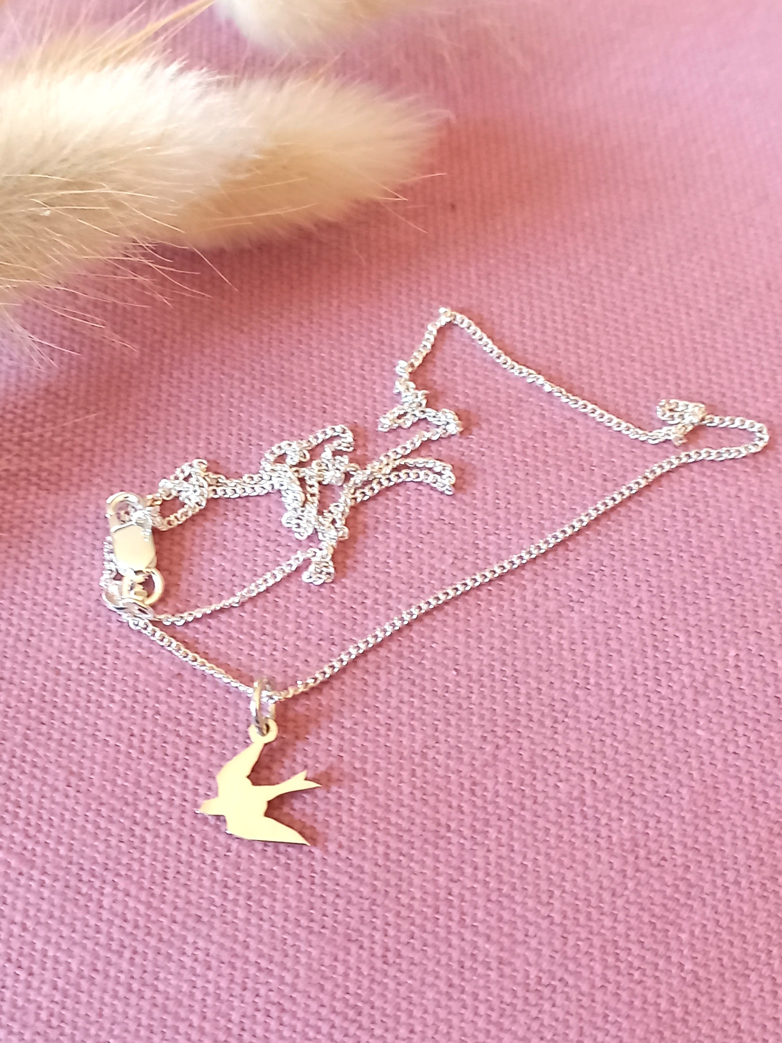 Swallow cutout pendant