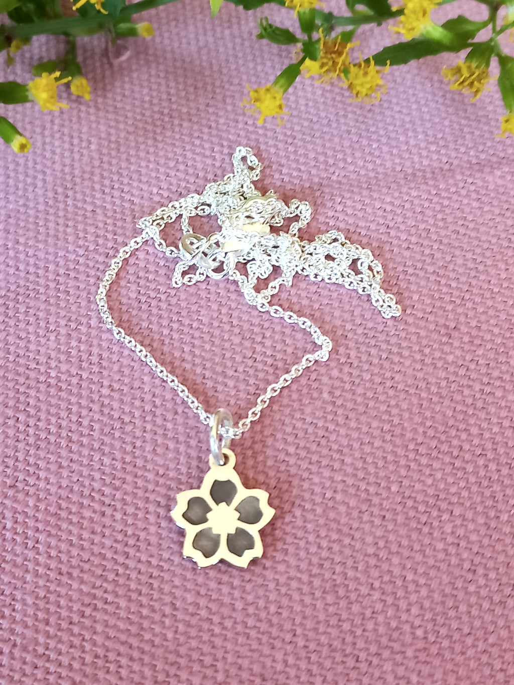 Flower cutout pendant