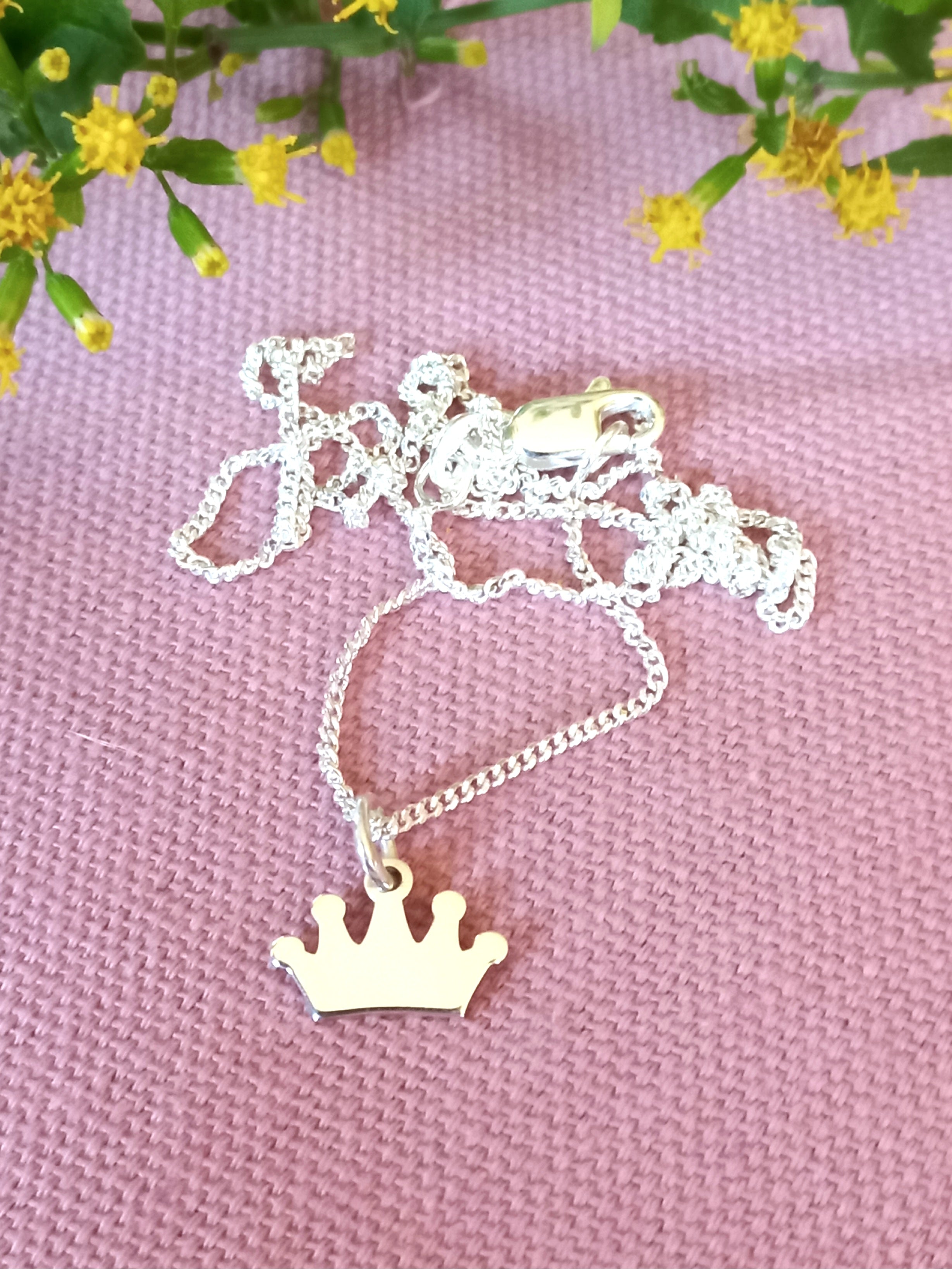 Crown cutout pendant