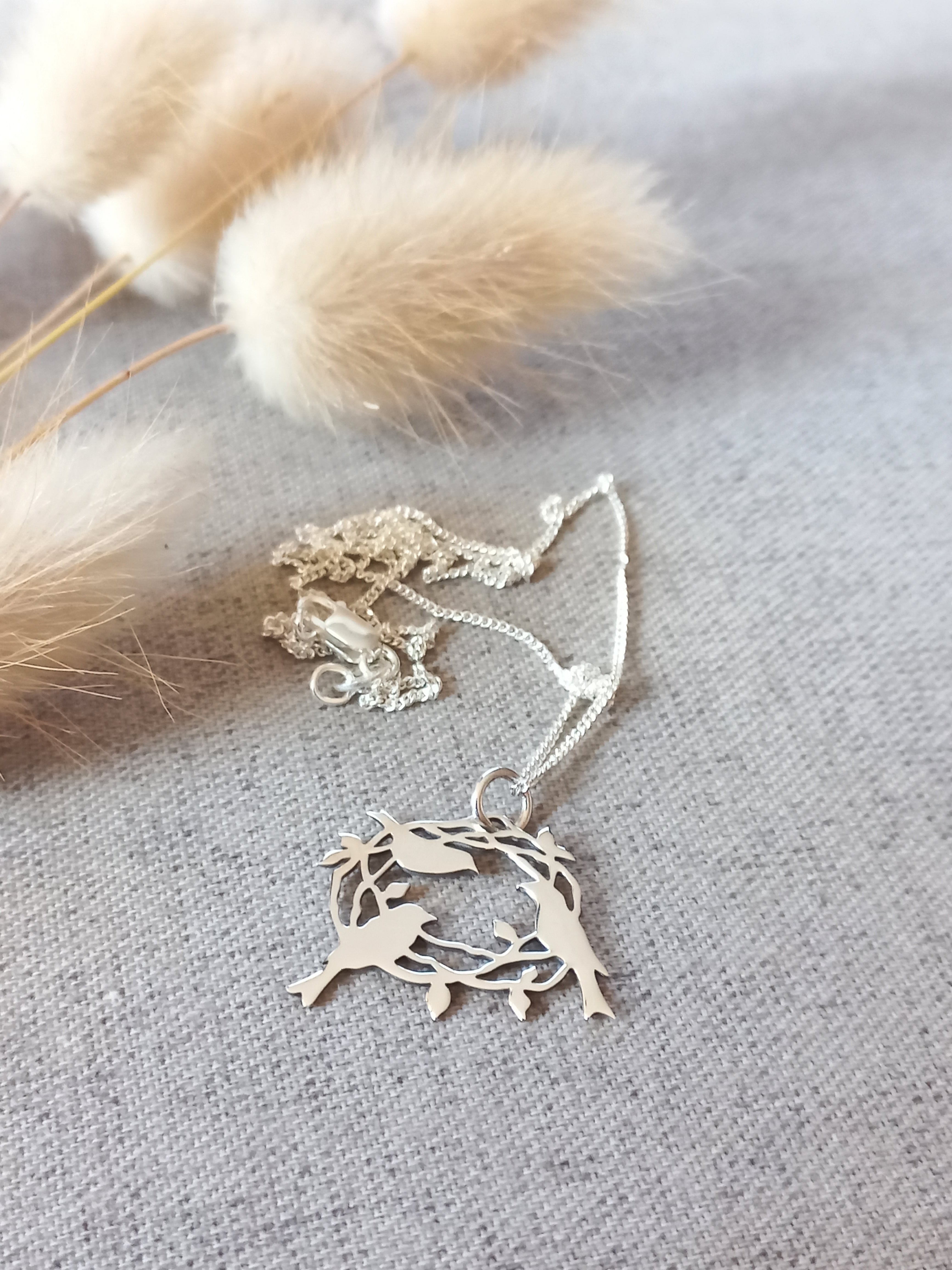 Birds' nest cutout pendant