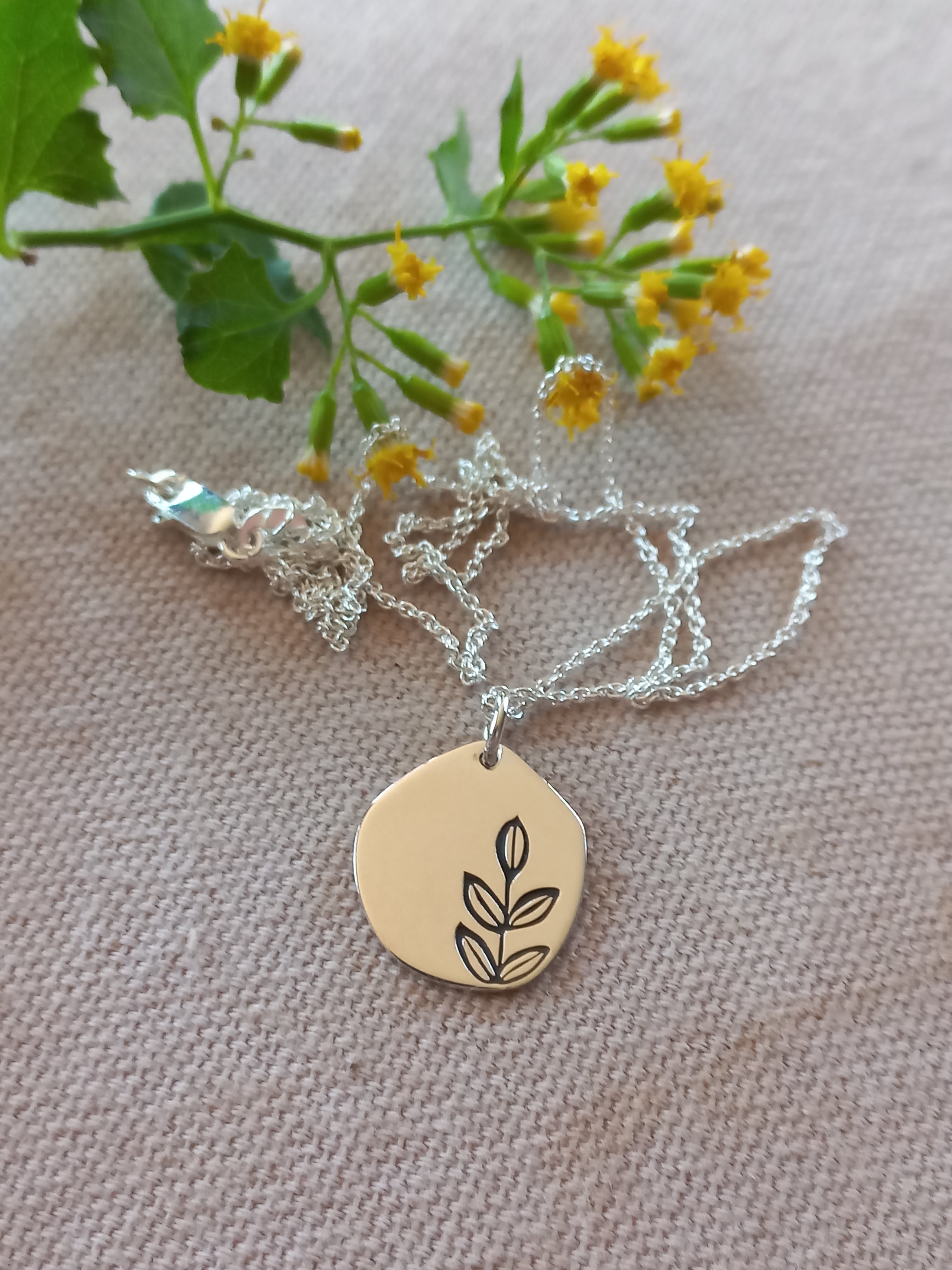 Free form leaf engraved disc pendant