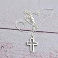 Outlined cross pendant