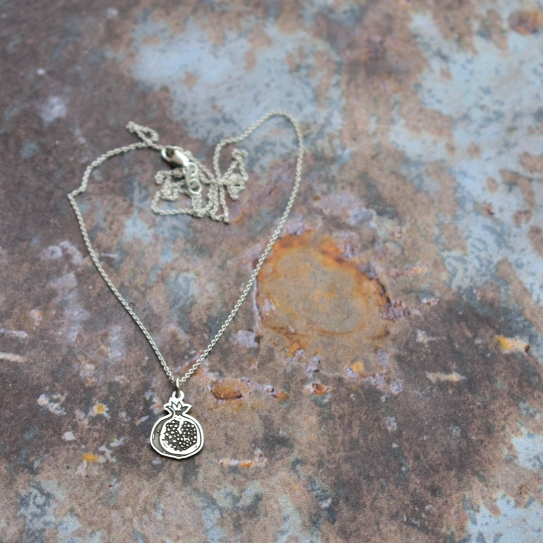 Pomegranate cutout pendant