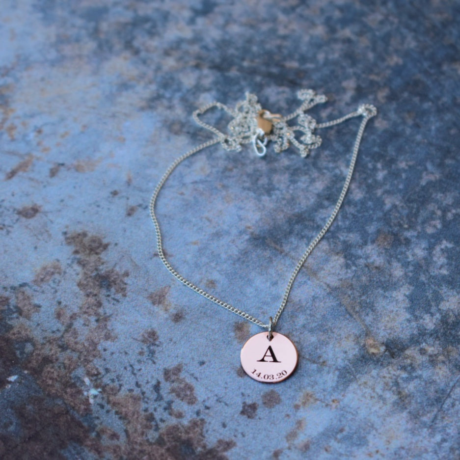 Engraved letter & date disc pendant