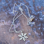 Snowflake cutout pendant