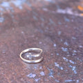 Cross fold-over ring