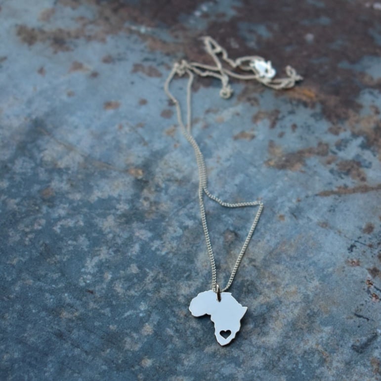 Africa with heart cutout pendant